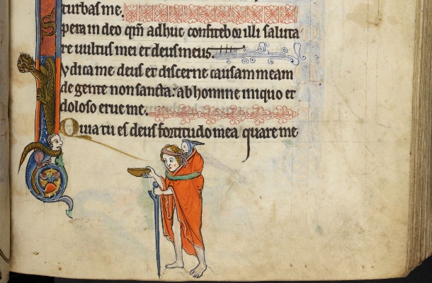 Tthe lower half of a page from a 13th century manuscript showing an ornate latin text with  illuminated illustrations on the left margin. Below the block of text, a barefoot man wrapped in a loose bright orange shroud, holds a cleft staff in the left hand and a shallow bowl in the rignt hand.. A small child or baby in a pointed hooded garment is strapped to the figure's back.