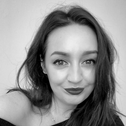 Photographic black and white, head and shoulders portrait of Alexandra Gallagher.