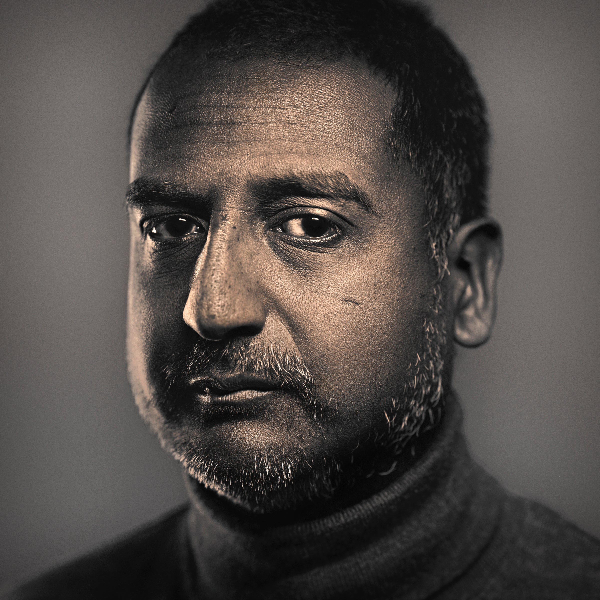 Black and white, head and shoulders portrait of David Jesudason.