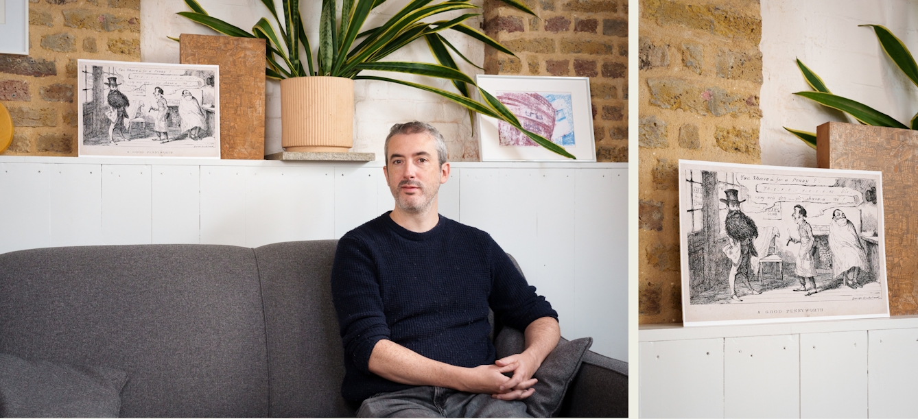 Photographic diptych made up of a landscape oriented image on the left and a portrait orientated image on the right. The left hand image shows a portrait of a man in a dark jumper sitting on a sofa looking to camera. Behind him on a tall white sideboard is a propped up print of a sketched satyrical caricature cartoon showing a man with a very large beard in a barber's shop. The image on the right is a closeup detail of the archive image.