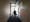 Photograph of Sarifa Patel walking down a corridor.