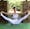 Steph Gongora sitting in yoga pose wearing white leggings stained with blood