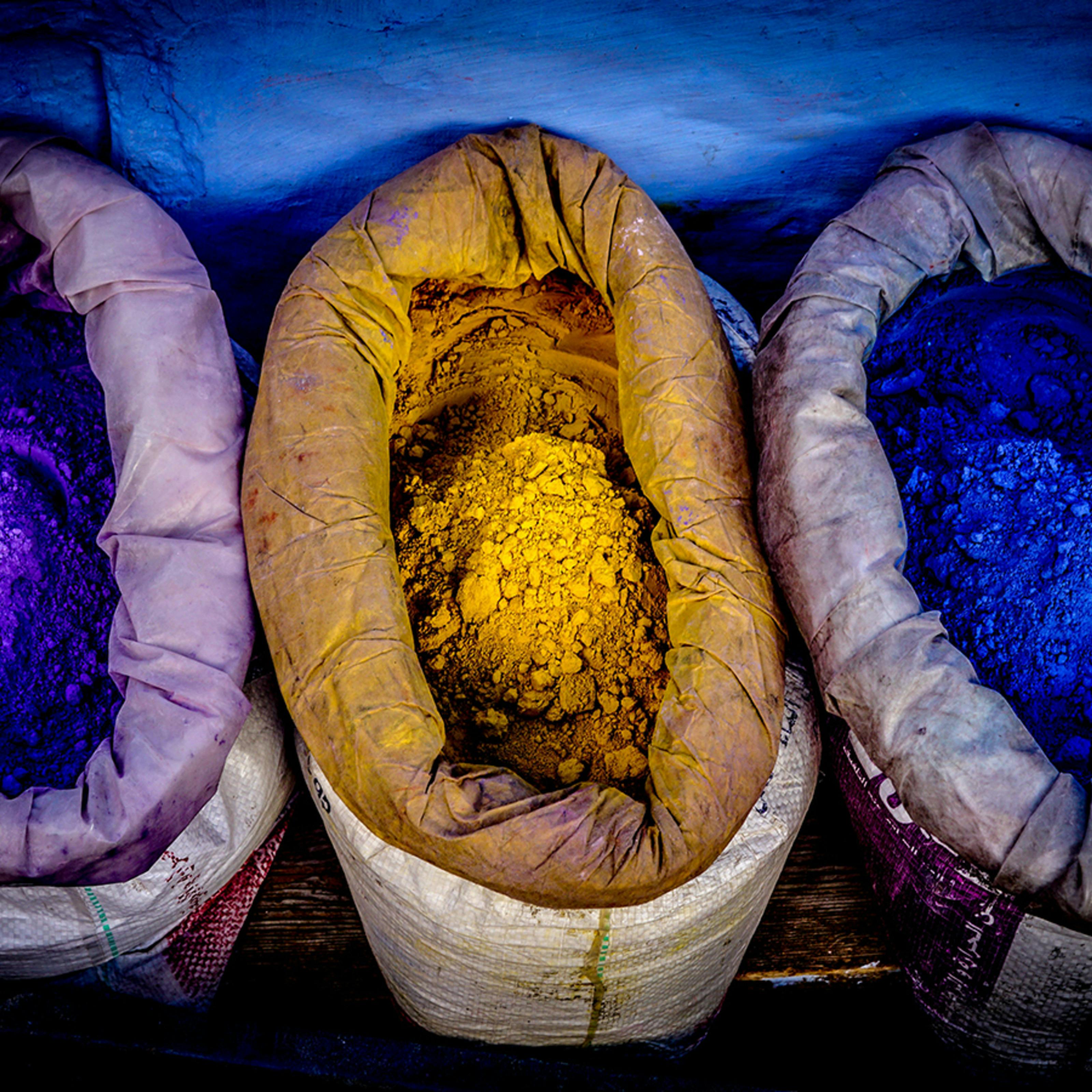 Sacks containing brightly coloured yellow and blue powder pigments