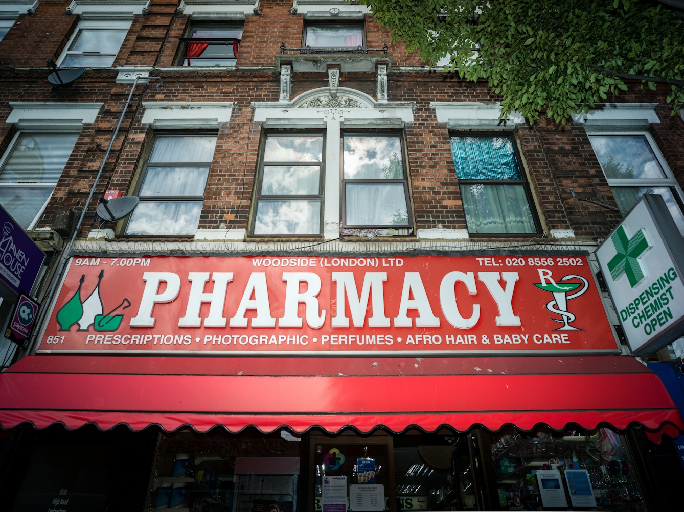 Shop front of the Woodside Pharamacy, London