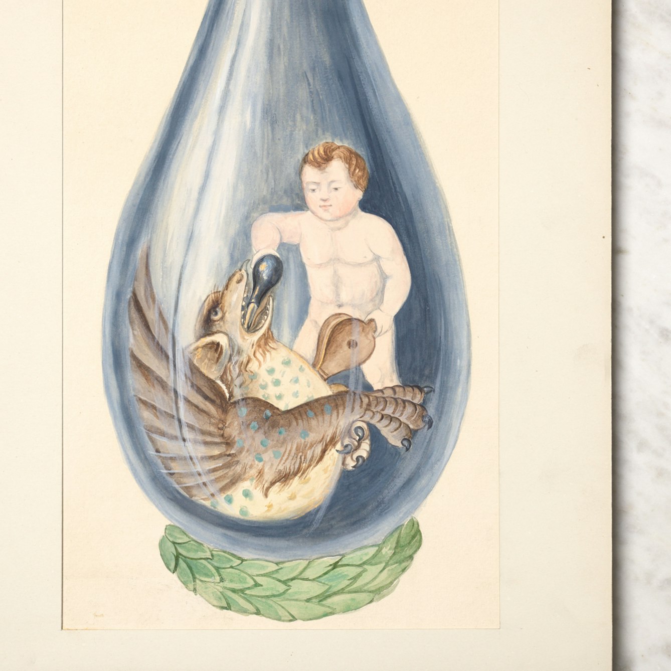 Photograph of a watercolour painting of a putto pouring a phial into a dragon's mouth. The watercolour is resting on a marble circular tabletop with rippled dark blue material on the floor beneath the table.