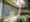 Photograph of a section of the front of the Finsbury Health Centre building showing the glass feature wall.