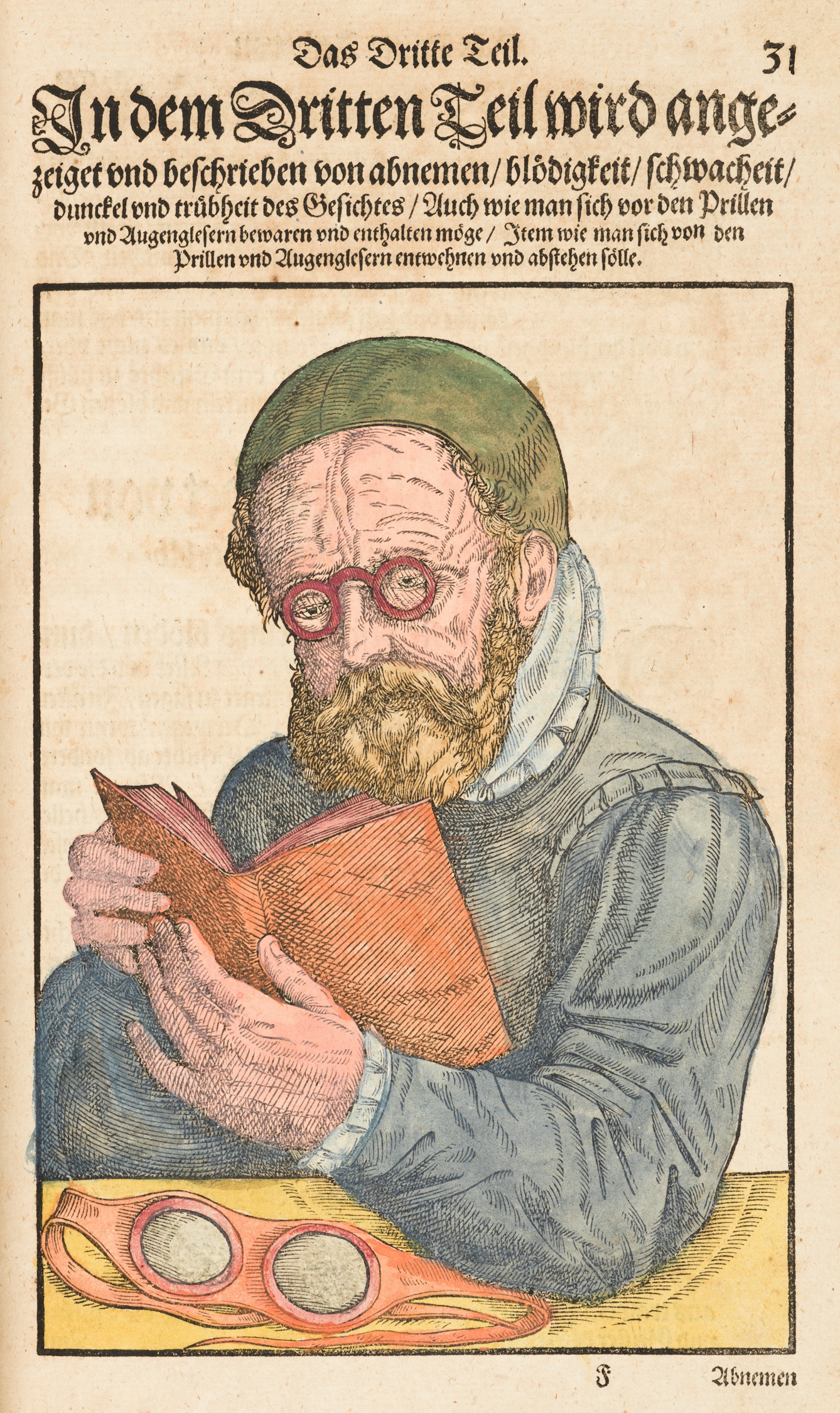 Coloured engraving from a 16th century book showing a man at a table holding an open book in his hands. He is wearing small round glasses. On the table in front of him are a pair red goggles. Above the engraving is ornately written German text.