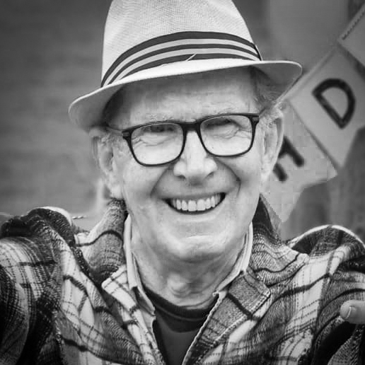 Black and white, head and shoulders photographic portrait of Chris North.