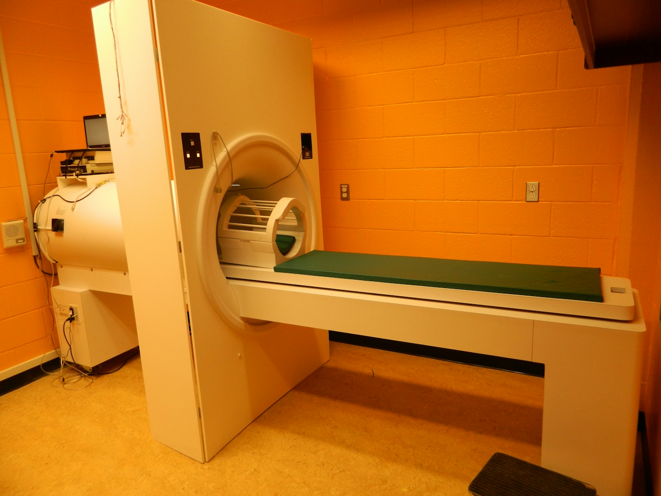 Framed colour photograph showing a fake MRI scanner.