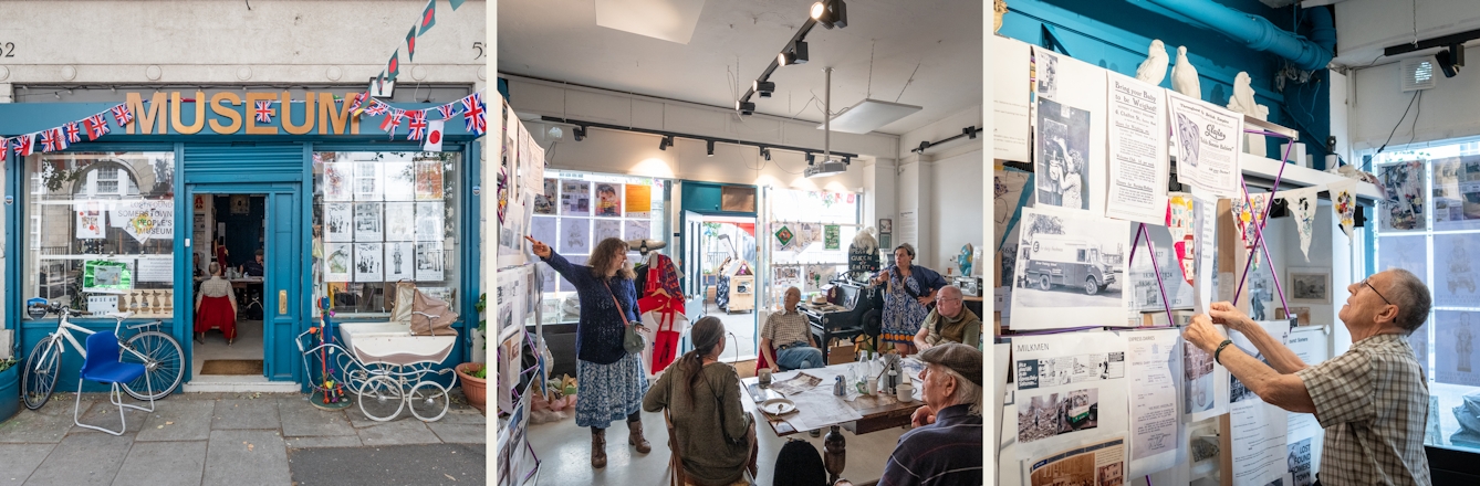 Photographic triptych of square photographs showing a workshop taking place in a community space. The left image shows the front of the community building with the word 'Museum' above the door. The centre image shows a woman pointing at a large display of printed material hanging off a display frame, whilst a group of 5 people sat around a table listen on. The image on the right shows a close-up of a man looking at some of the printed material suspended from the frame.