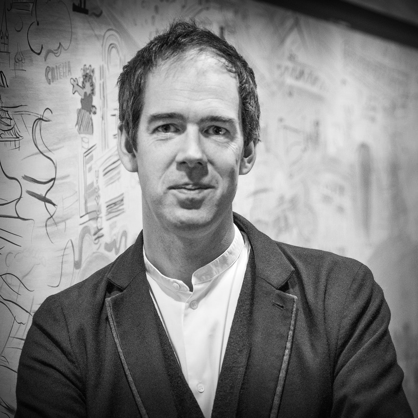 Black and white, head and shoulders portrait of Jonty Claypole.