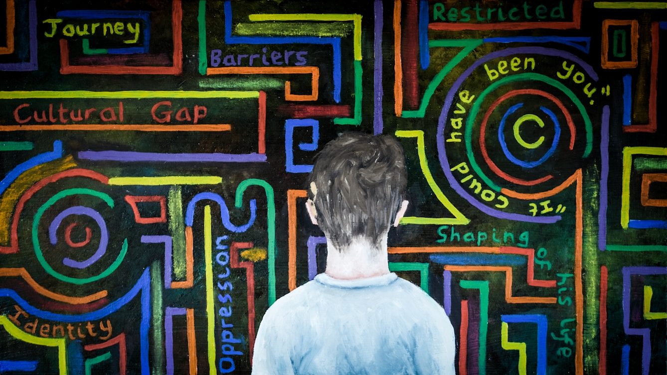 Oil painting showing the back of the head and shoulders of a young boy who has a cochlear implant above his left ear. In front of him, against a black background, is a maze of coloured lines, both straight , curved and circular. In-between the lines are words and phases, for example, journey, barriers, cultural gap, restricted, it could have been you.