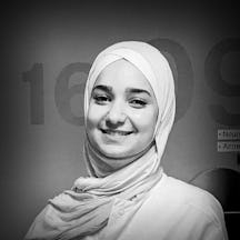 Black and white, head and shoulders portrait of Sedra Al-Yousef.