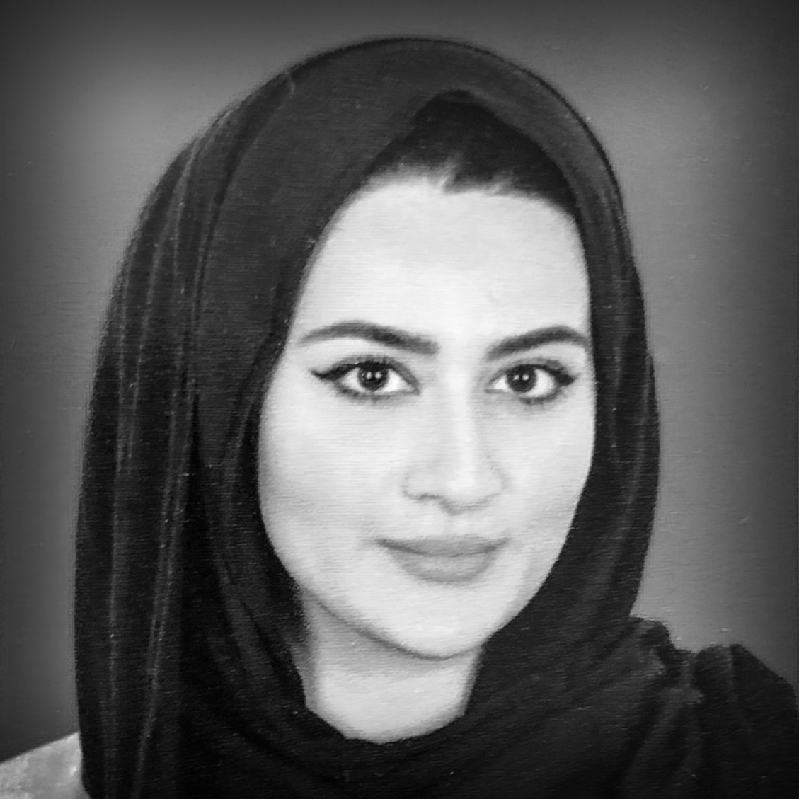 Black and white, head and shoulders portrait of Abi Palmer.