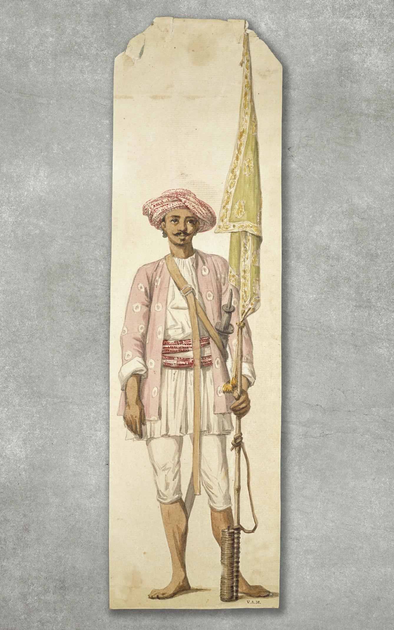 Colour painting of an Indian soldier of Tipu Sultan's army, using his rocket as a flagstaff. The rocket has a green patterned flag attached to the top of it. The soldier is wearing a 'Tyger Jacket', a long purple woollen shirt with white diamond formed spots on it. On his head the soldier wears a red and white muslin turban, matching the red sash around his waist. Beneath his white trousers, his legs and feet are bare.