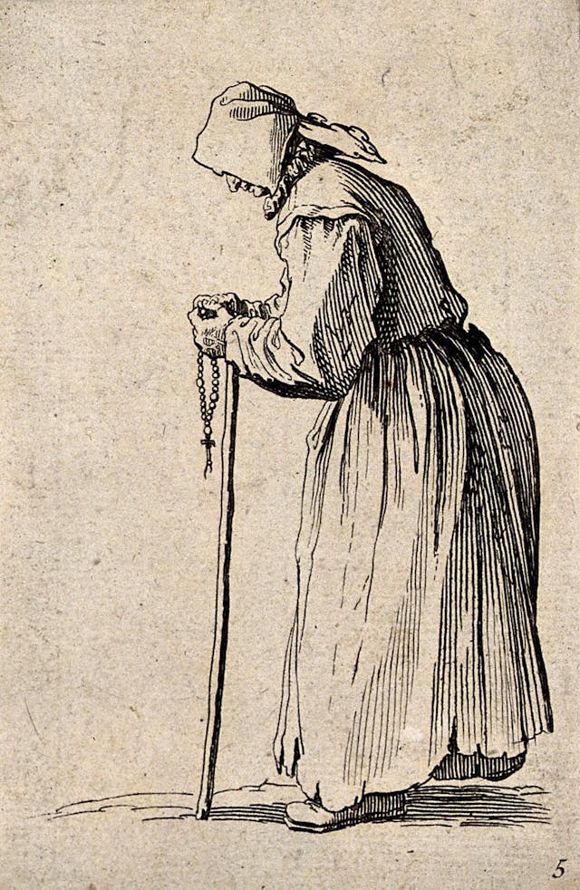 Etching of an old woman dressed in rags holding a rosary in her left hand and a staff in her right. Her face is hidden behind a hood.