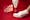 A photograph of a mirror on a red background. In the foreground are two hands, with one pulling an anatomical illustration from behind the other. In the reflection of the mirror is a an open, empty hand.