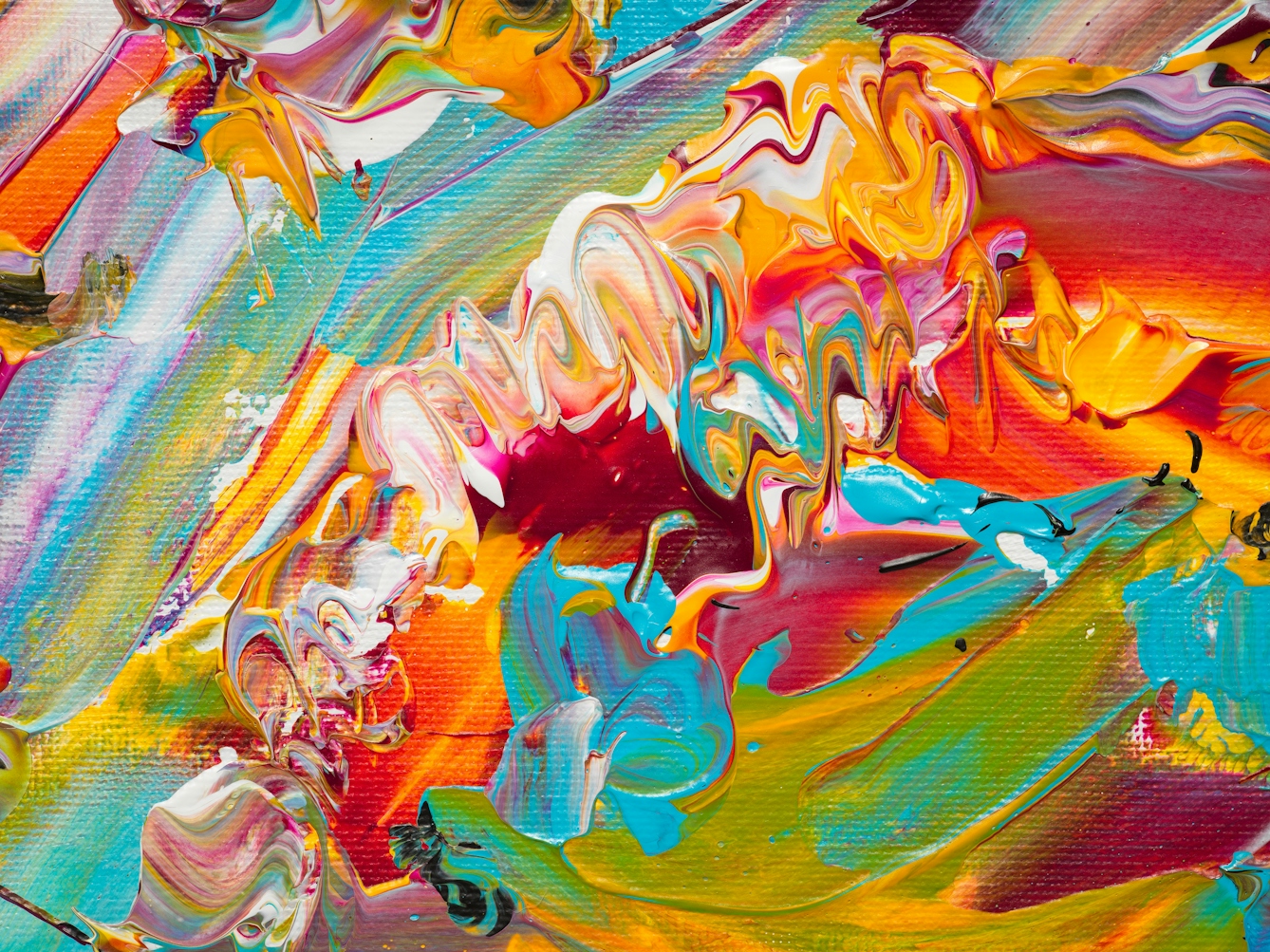 Photograph of close-up detail of a larger abstract  expressionist painting  utilising acrylic paint on a rectangular canvas in landscape orientation. A vast majority of the canvas surface contains many scattered, complex and confusing marks and gestures of vibrant and colourful tones - including yellow, pink, orange, turquoise, white. It's akin to a frenetic and overwhelming scene of repeated surprises and shocks.