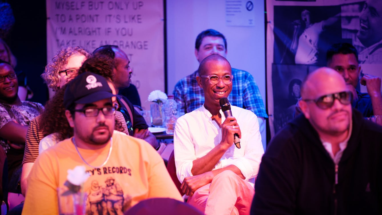 Photograph of a Heart n Soul event showing a member of the audience talking with a microphone.