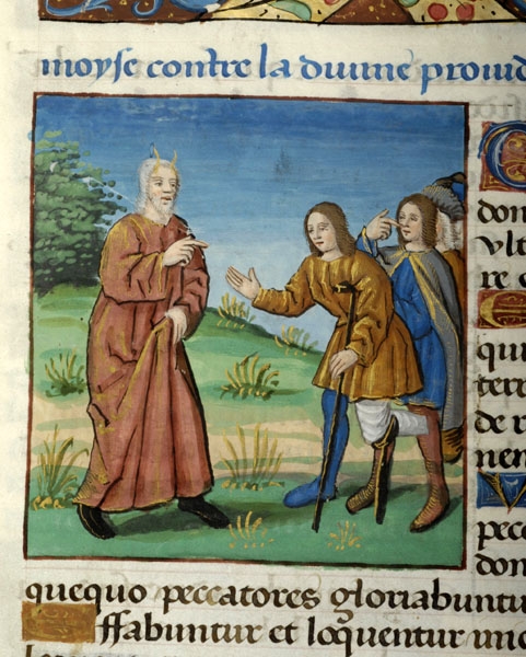 Detail from a 15th century manuscript of an illustration embedded in highly decorative text. The painted image shows a horned Moses with his finger pointing towards a man at the front of a queue of men waiting to see him. The first man in the queue has an amputated foot and the stump of his leg rests on a Y-shaped stick at the knee while he leans on a single crutch with shoulder support for balance and reaches out his other arm towards Moses. The man behind him is pointng at his own nose.