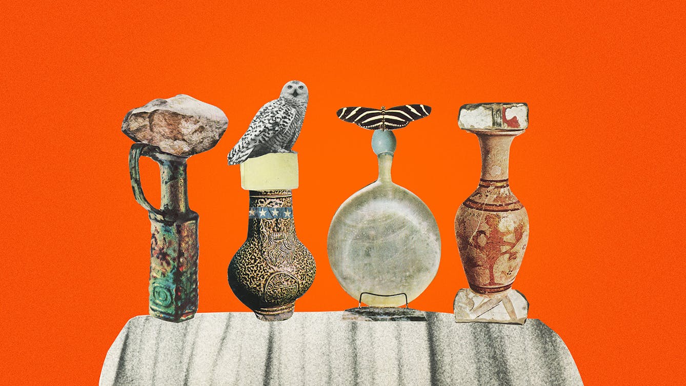 Coloured photograph of a paper collage on a bright orange background. Shown are four urns fashioned out of different paper cut-outs stood upright next to eachother. There is a black and white cut-out owl owl on top of one of the makeshift urns, and a butterfly with its wings spread on another. The urns are positioned on top of a grey stone-like cut out. 