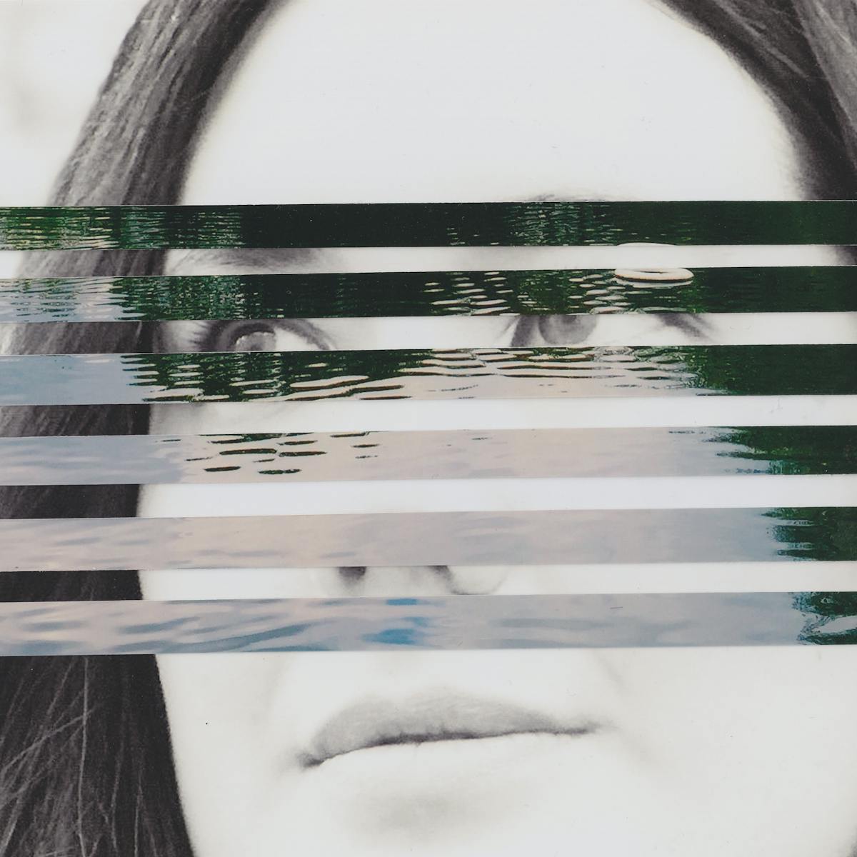Mixed media collage artwork using a combination of two different photographic prints. The background of the collage is made up of a black and white photograph of the head of a young woman with long dark hair. She is looking off to camera left with a neutral expression on her face. Overlaid on top of her portrait, running through the centre of the image, are horizontal strips of a colour photograph showing a large expanse of open water with the ripples on the surface of the water visible through the light and dark reflections. The horizontal strips are spaced out such that the portrait beneath can be seen through the gaps.