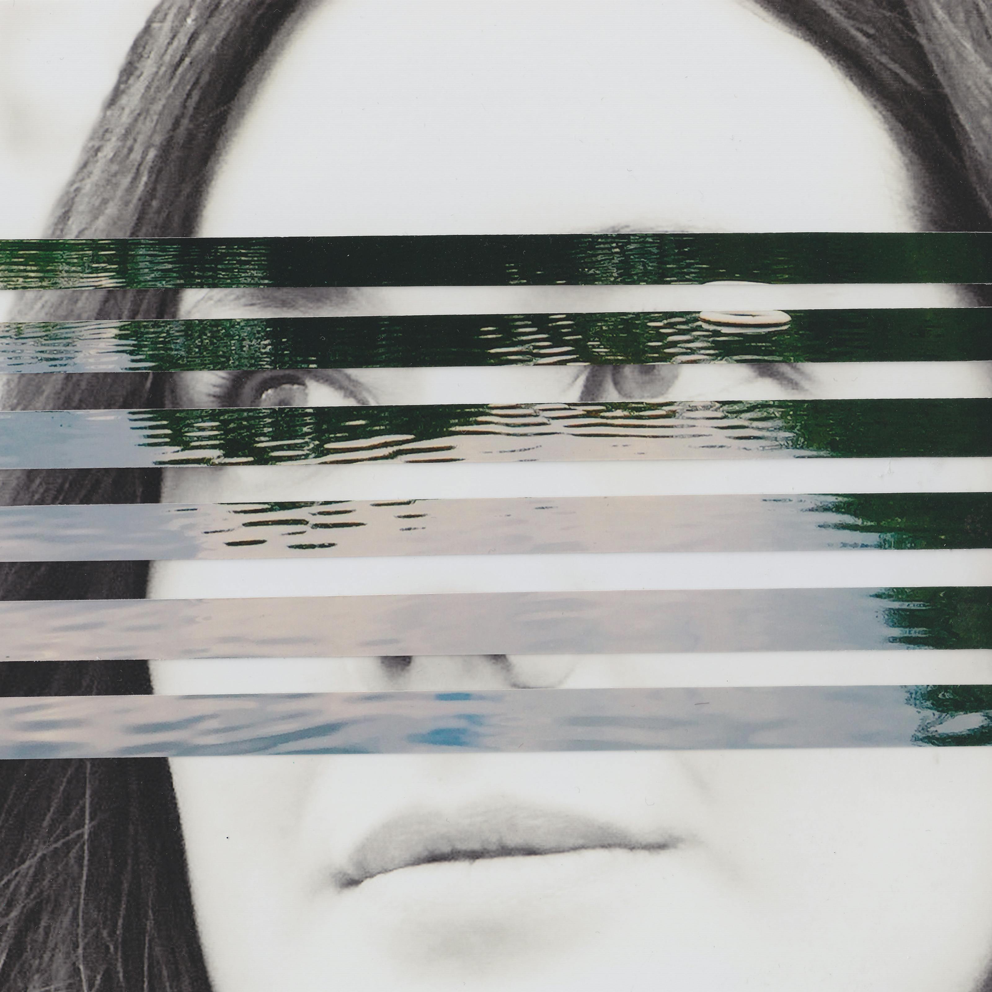 Mixed media collage artwork using a combination of two different photographic prints. The background of the collage is made up of a black and white photograph of the head of a young woman with long dark hair. She is looking off to camera left with a neutral expression on her face. Overlaid on top of her portrait, running through the centre of the image, are horizontal strips of a colour photograph showing a large expanse of open water with the ripples on the surface of the water visible through the light and dark reflections. The horizontal strips are spaced out such that the portrait beneath can be seen through the gaps.