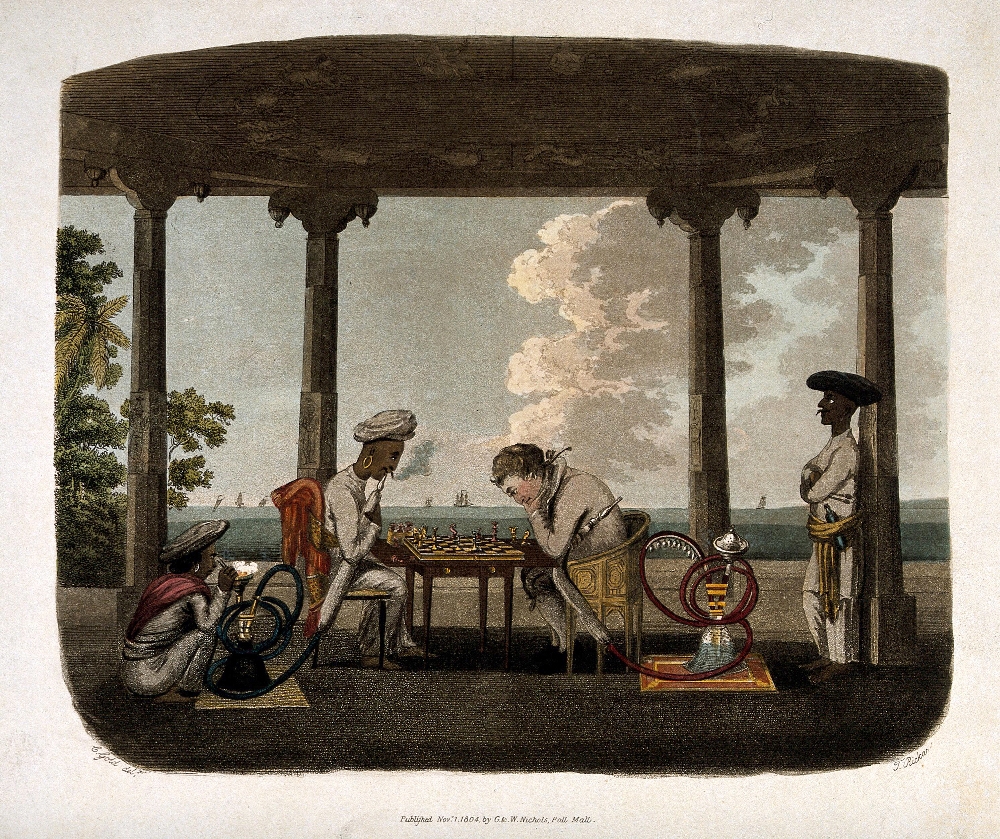 A European man and an Indian man playing chess under an open Indian structure while smoking hookahs and each attended by a hookah bardar