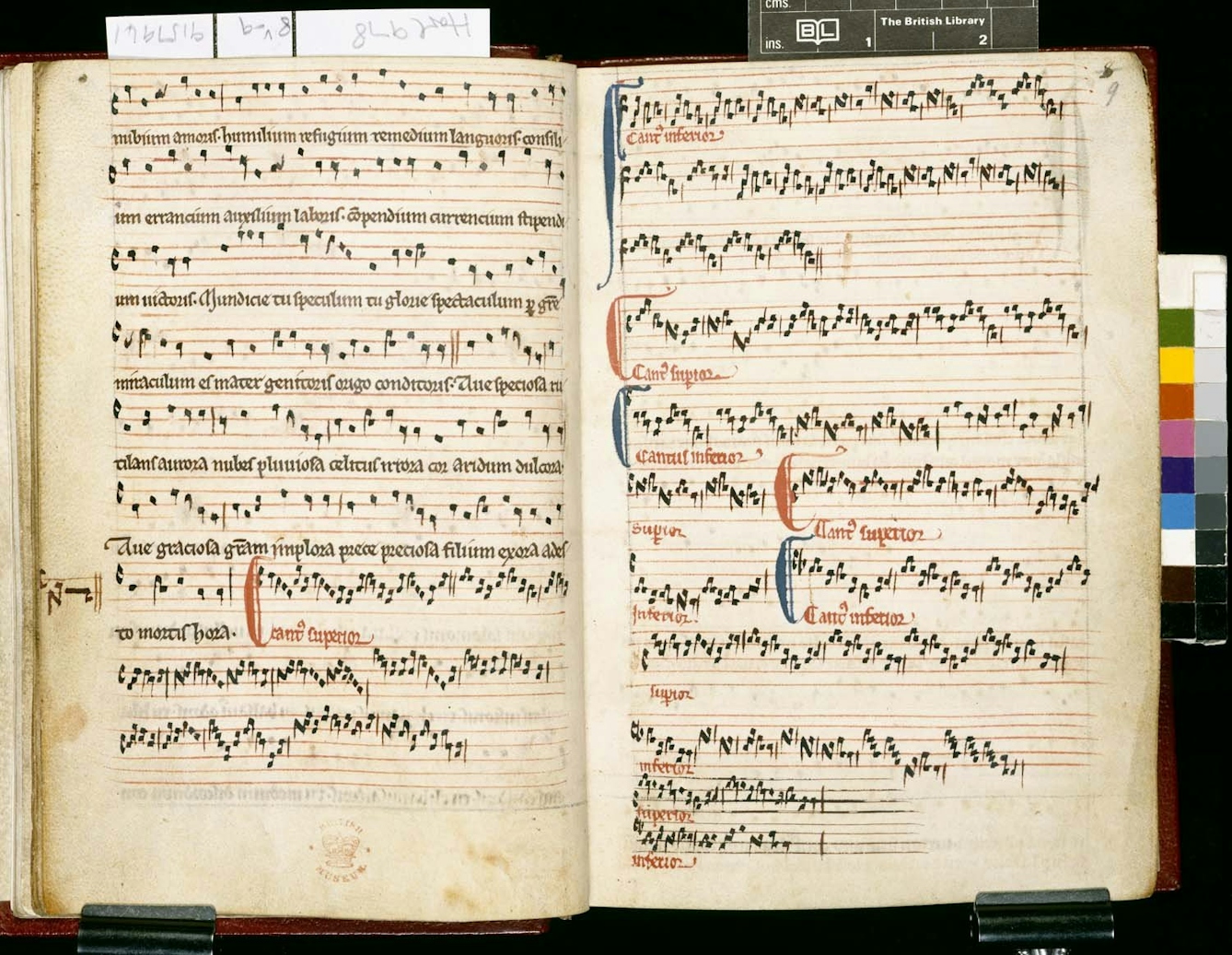 Musical notation on stave with stave-high coloured capitals.