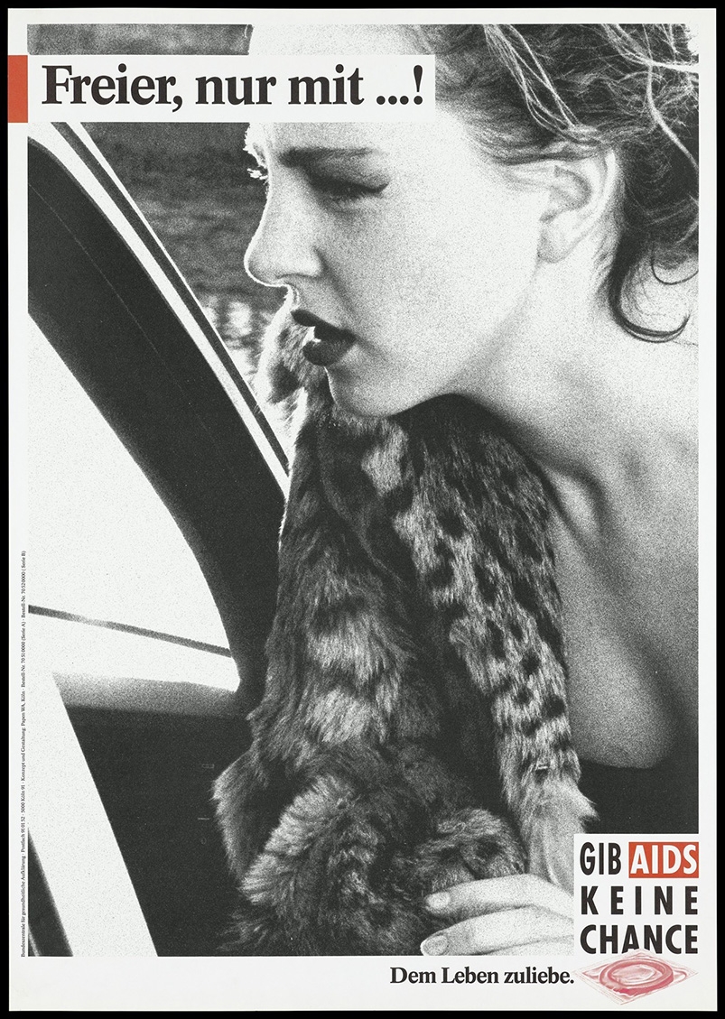 A black and white close up picture of a woman leaning into a car window wearing a leopard print fur coat.