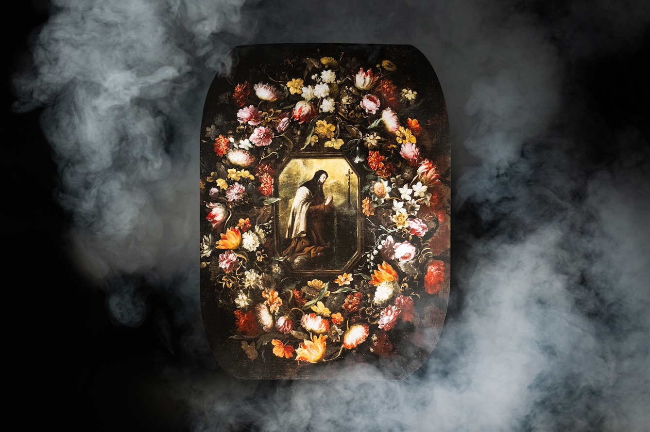 A photograph of a painting of St Teresa, surrounded by flowers. The painting is surrounded by swirls of white smoke.