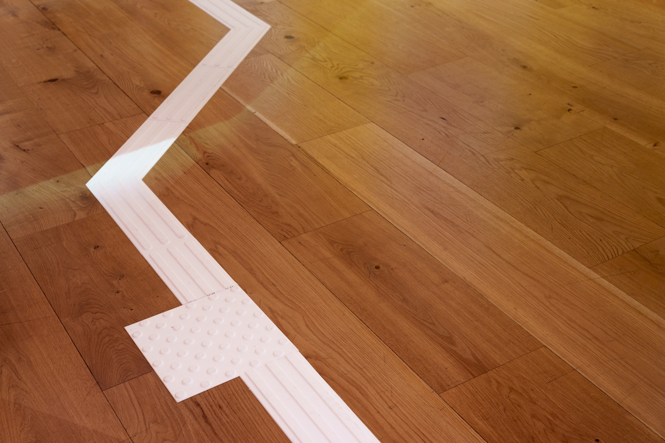 Photo of a white line on the floor to guide you round the stops on the digital guide.