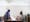Photograph of Sarifa Patel with her personal assistant working at a table in her living room.