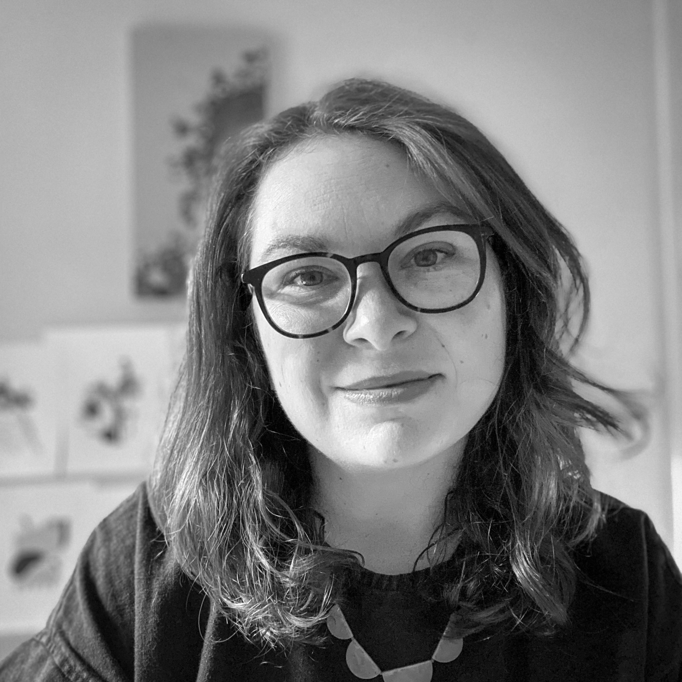 Black and white, head and shoulders portrait of Hollie Chastain.