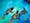 Detail from a larger colourful watercolour artwork. The artwork shows an underwater scene. There are two figures with scuba diving equipment of flippers and oxygen tanks. There is a dolphin swimming alongside them.