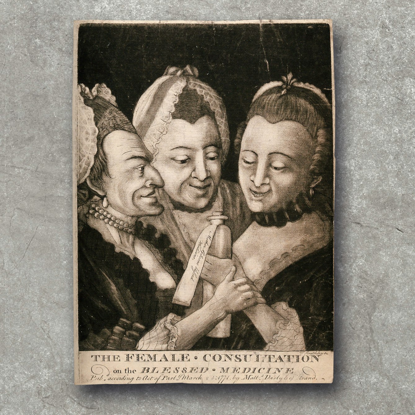 18th century Mezzotint showing three women gathered around a medicine bottle. Text along the bottom reads 'The Female Consultation on the Blessed Medicine'. 
