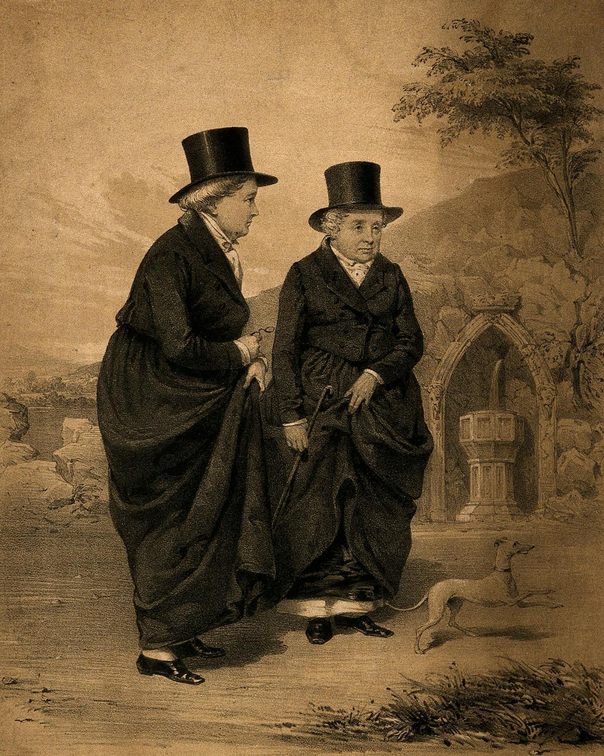 Etching showing 2 ladies in black overcoats and top hats standing together outside in a country scene. One holds a cane and the other a pair of spectacles. at their feet is a small dog, mid jump. Behind them are trees, rocks and carved stone fountain.