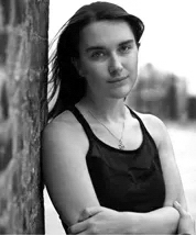 Black and white, head and shoulders portrait of Eden Rickson.