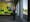 Photographic full length portrait of Mandy English, a paramedic, in her ambulance station.