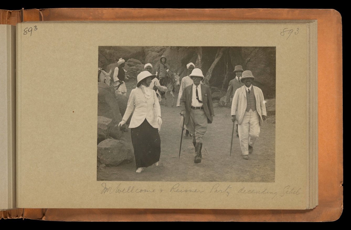 Black and white photograph in an album of Henry Wellcome and friends visiting the Gebel Moya archaeological site in Sudan, 1910-1911
