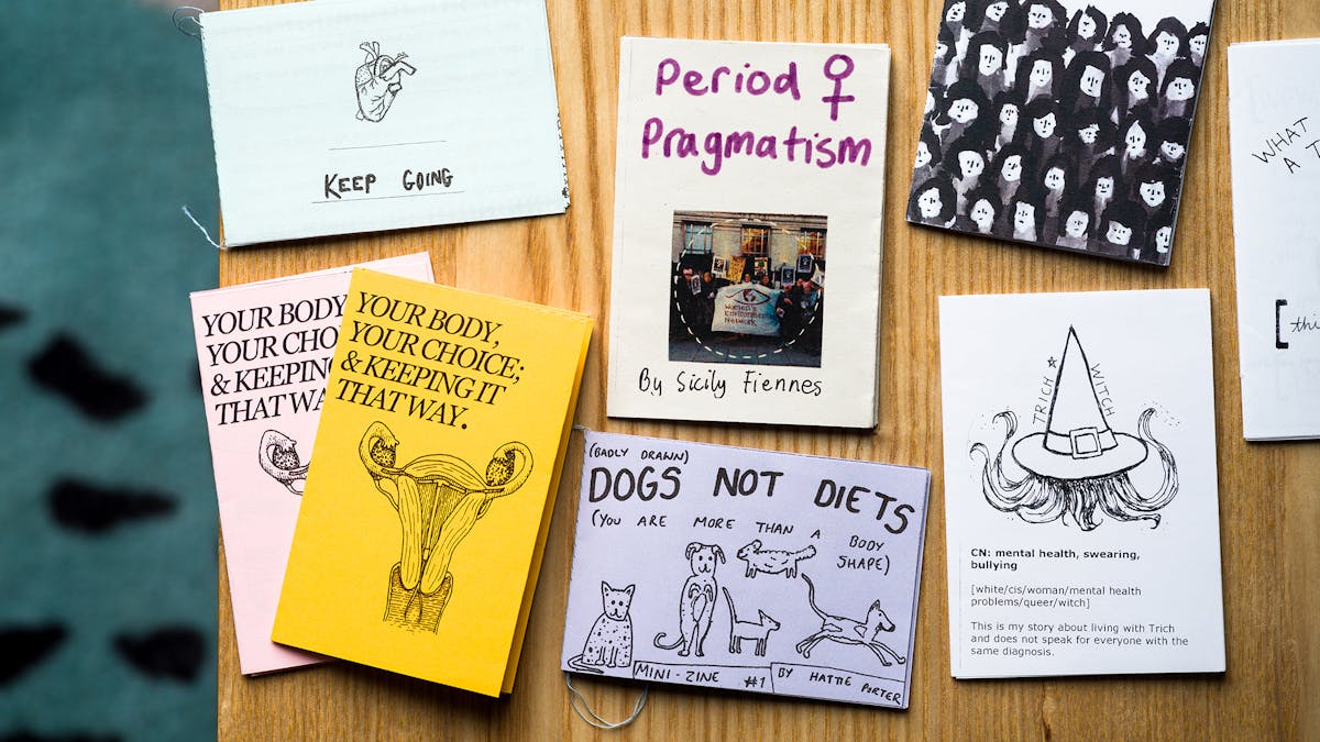A selection of zines displayed on a table.