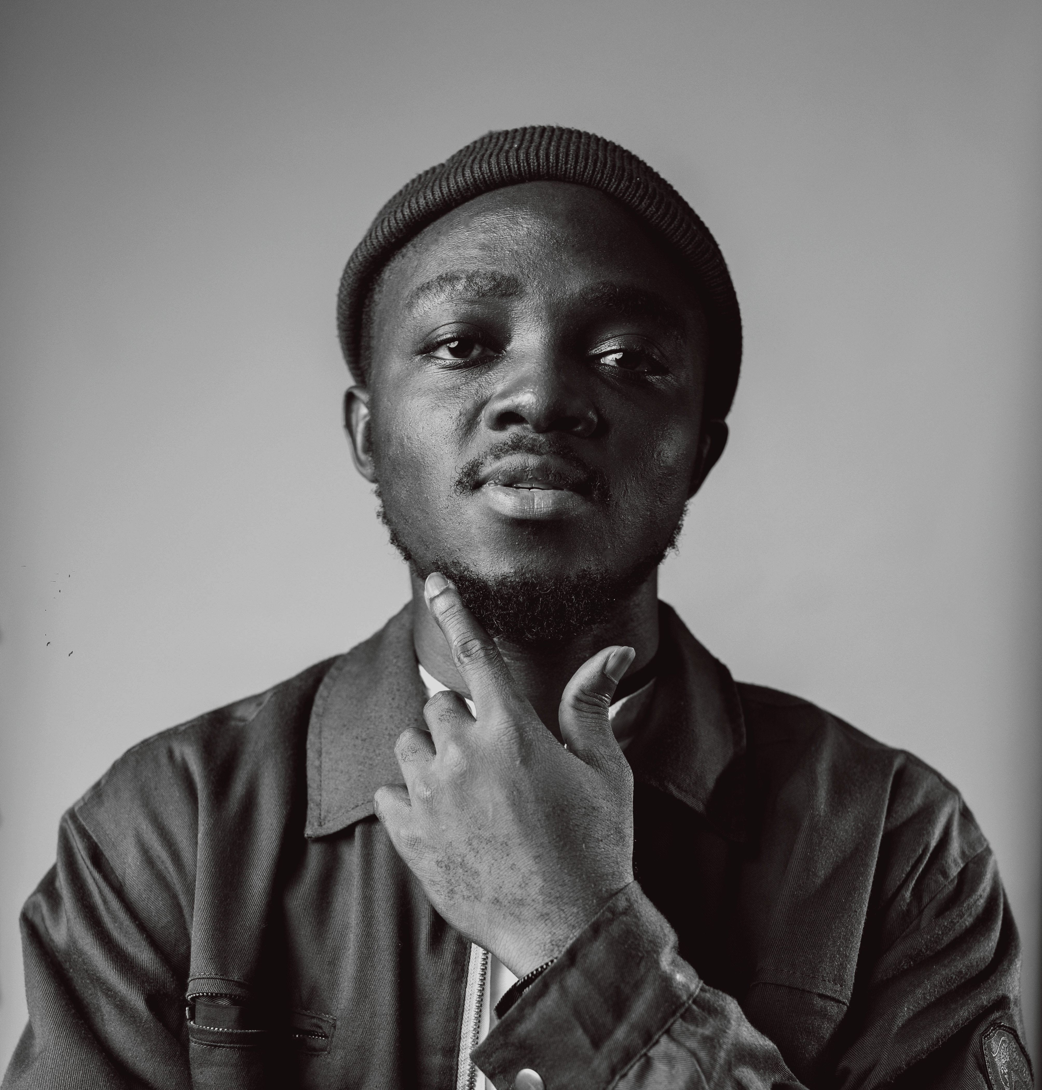 A black and white head and shoulders photo of Yaw Afrim Gyebi