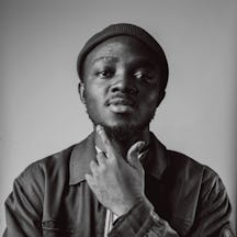 A black and white head and shoulders photo of Yaw Afrim Gyebi