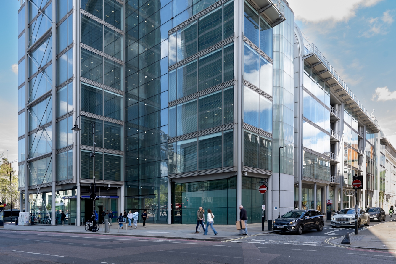 Entrance to Euston Square underground rail station in a modern steel and glass building.