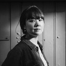 Black and white, head and shoulders photographic portrait of HifuMiyo.