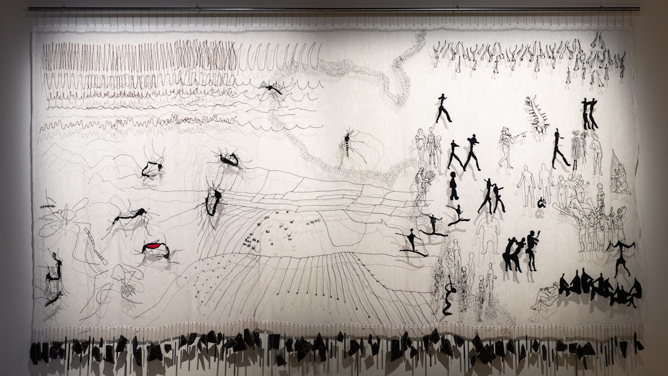 A photograph of 'Mosquito Shrine' on display in our exhibition, Hard Graft.