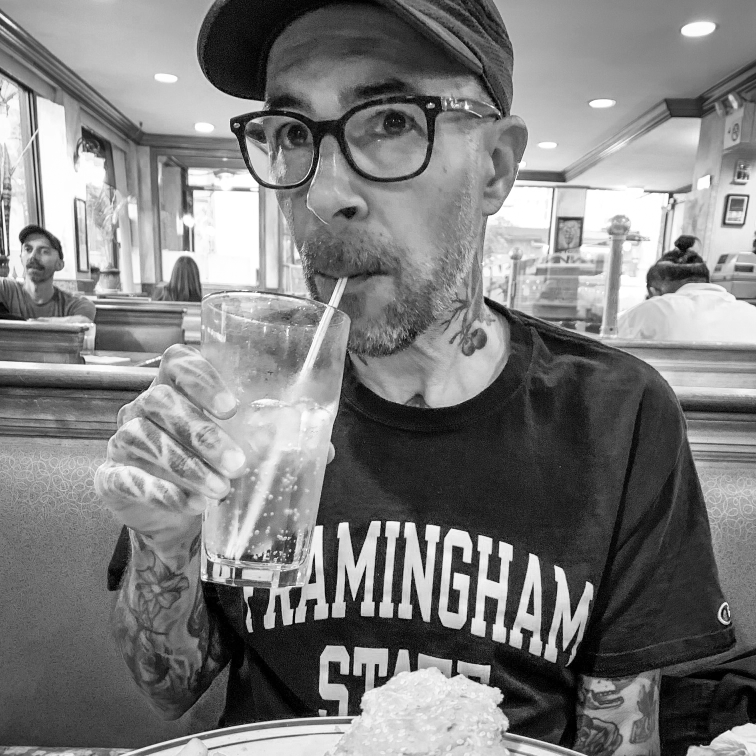 Black and white head and shoulders photographic portrait of Alberto Casias.