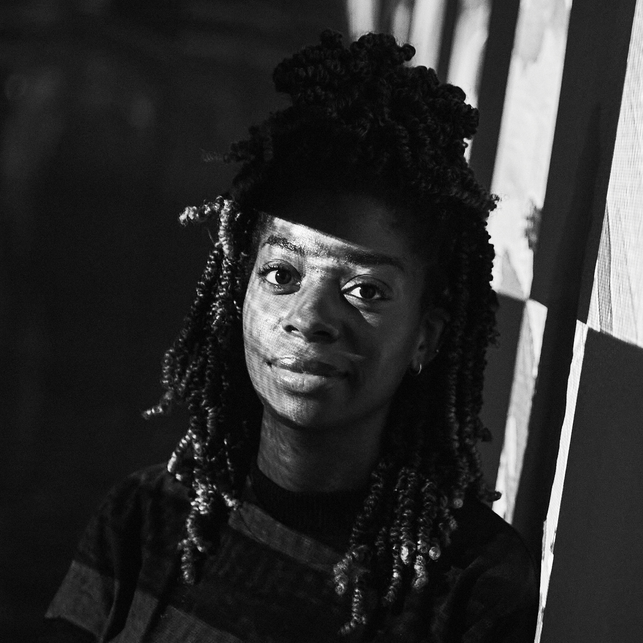 Black and white head and shoulders portrait of Jess Nash.