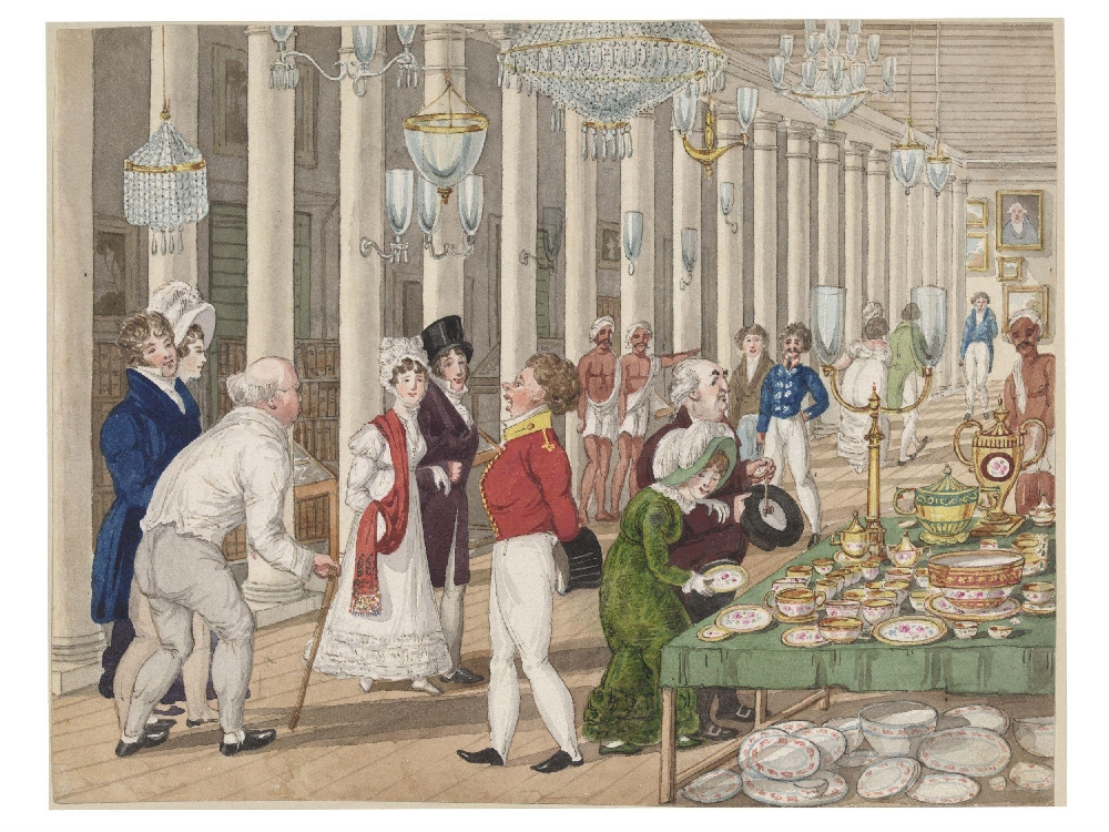 European men and women in a grand assembly hall, walking around and taking food from fine china crockery on a table, attended by Indian servants
