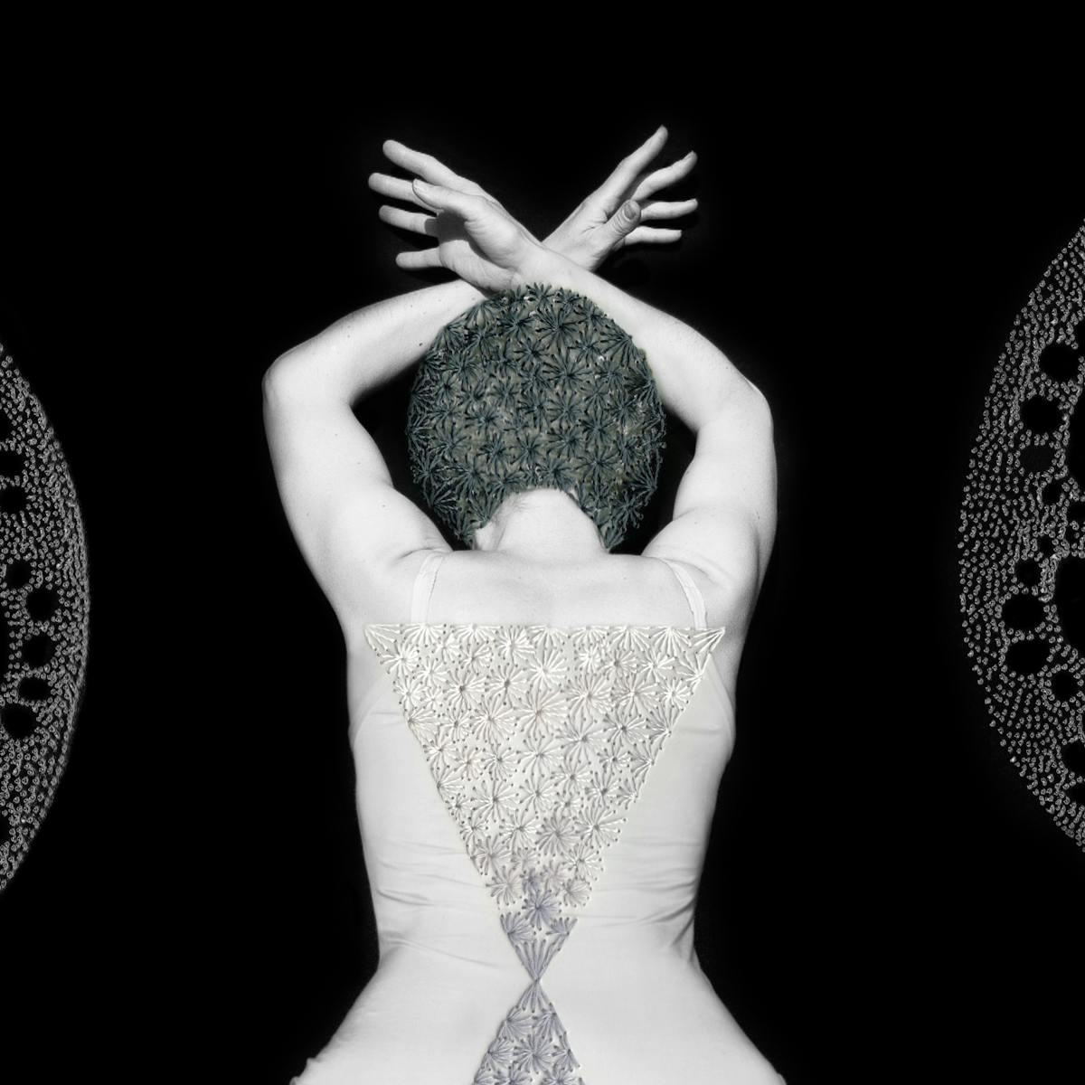 Artwork made up of a black and white photograph of a female figure from behind, from the waist up, against a black background. Her arms are held above her head and her wrists cross, fingers extended. Embroidered into the photographic print with grey thread is a crisscross floral pattern which exactly covers her head and hair. Across her back, embroidered in silver thread is a large triangle connected to a smaller triangle. Either side of the figure are two large curved forms made up of a layered texture of dots.